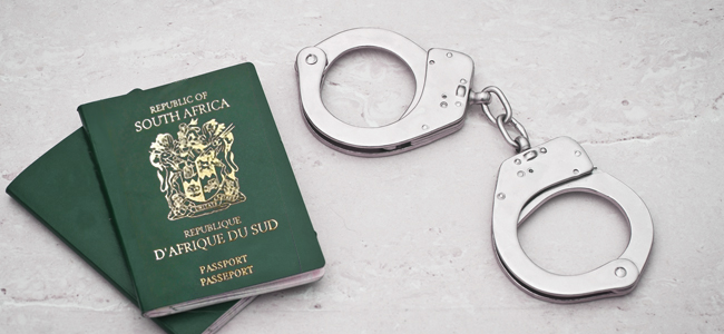 passport with handcuffs – prison concept